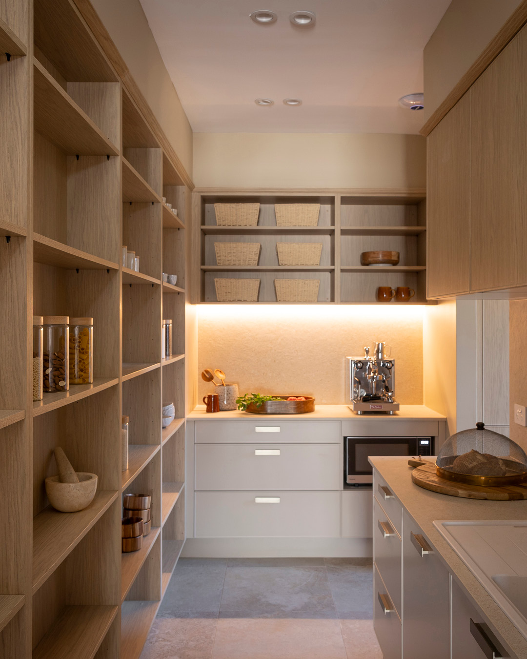 Walk-in butler's pantry with open shelves and storage space