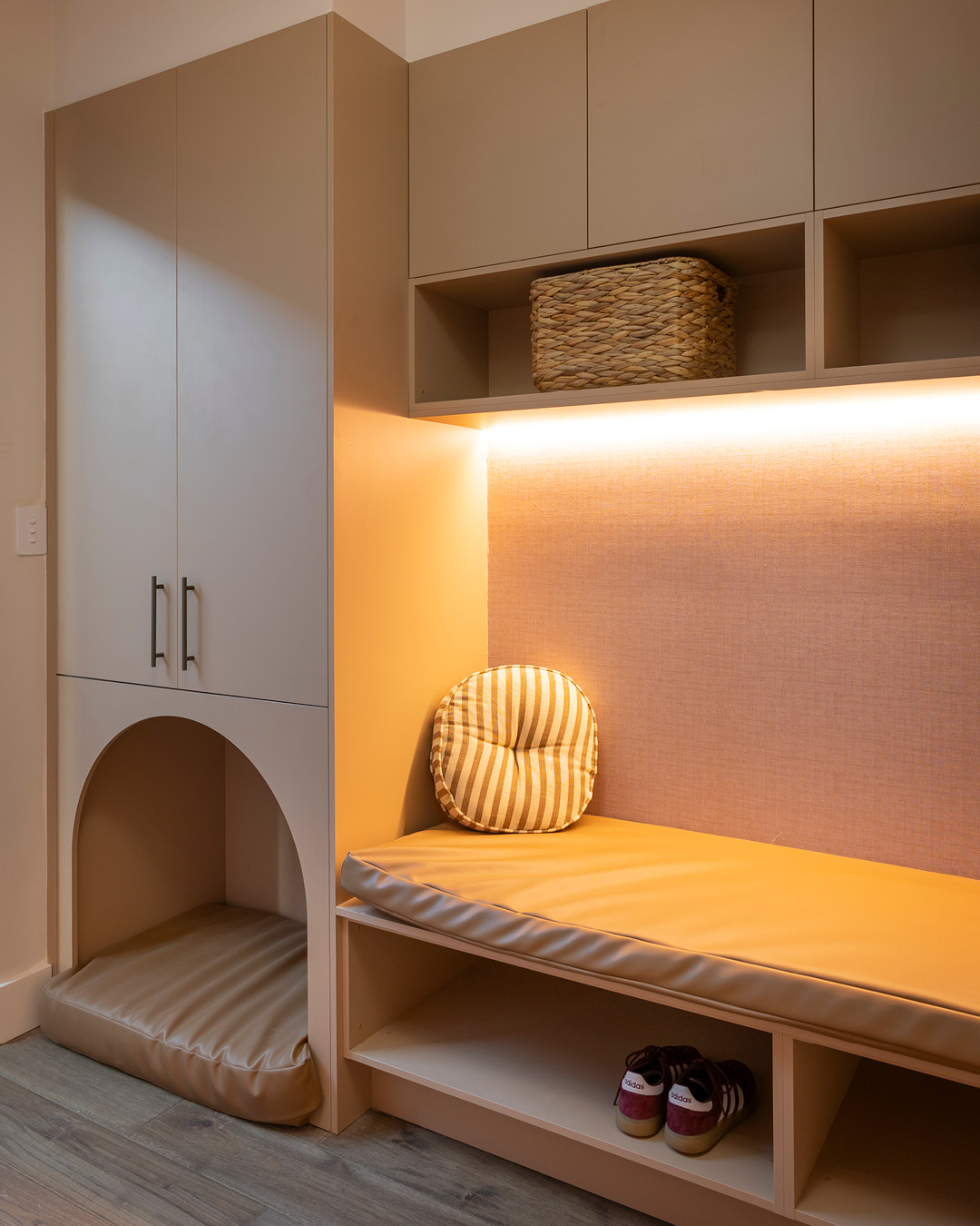 Oak timber look mudroom with arched pet bed.