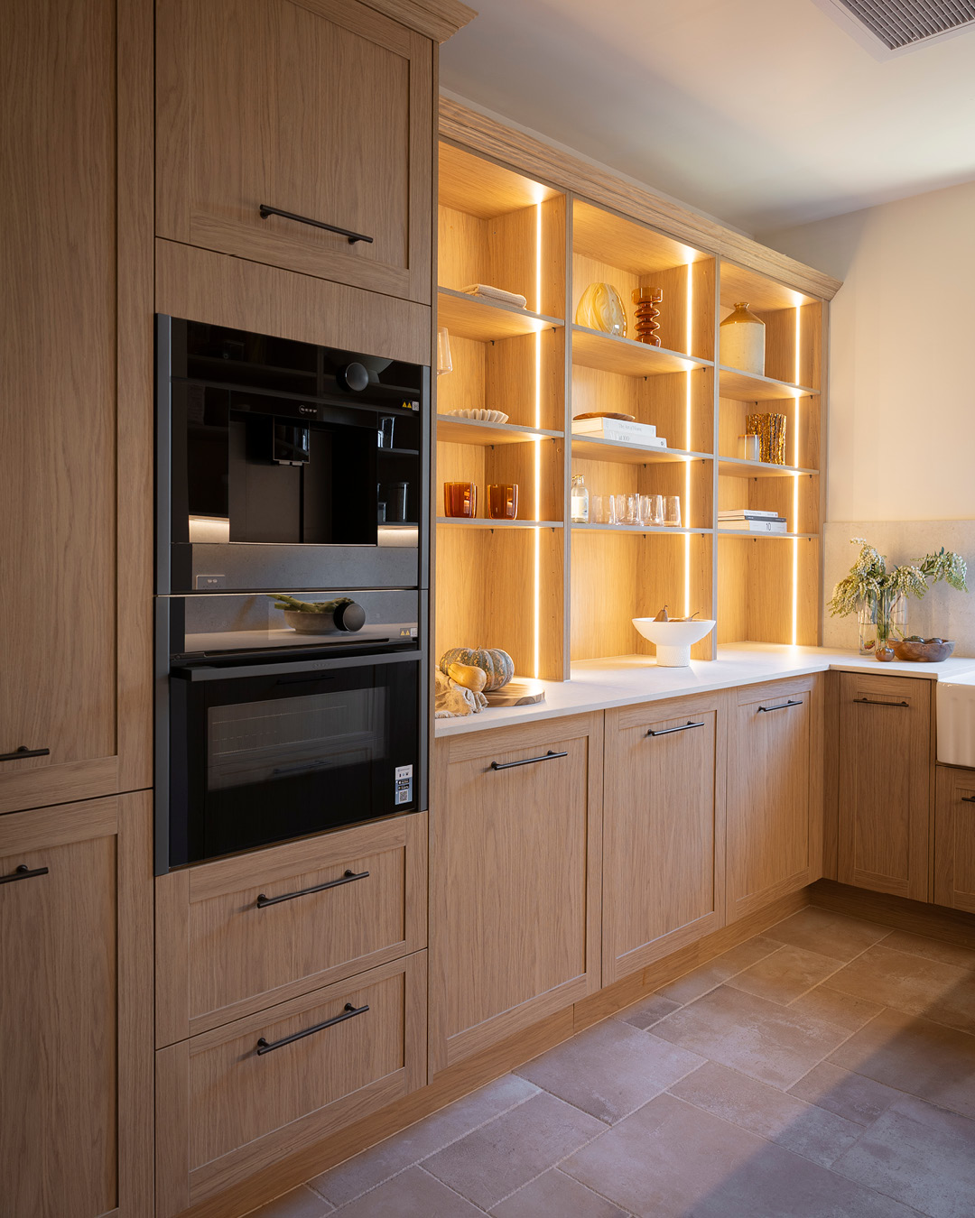 Pantry with oven and open shelving Shaker-style Nordic Oak cabinetry with bronze handles.