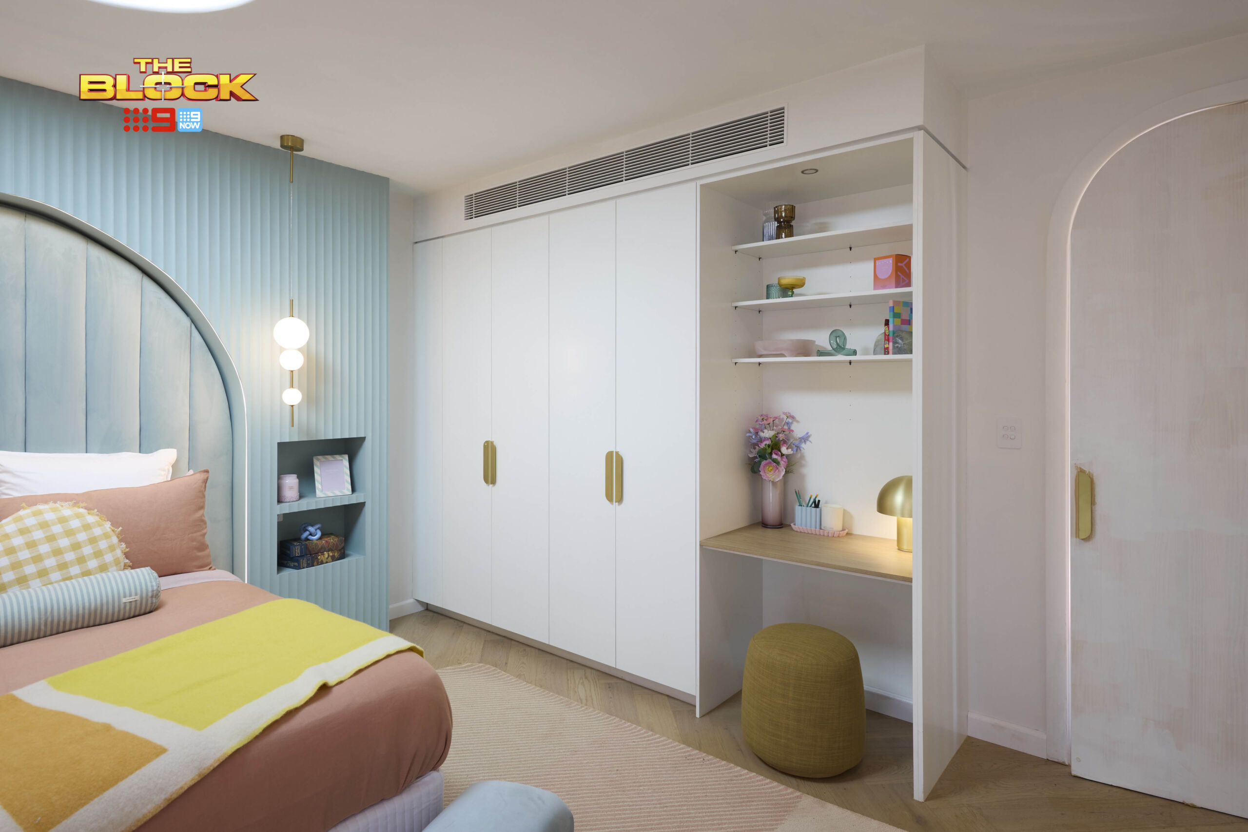 white-built-in-wardrobe-with-gold-handles-and-desk