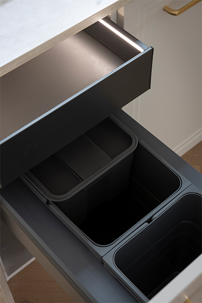 Häfele Ninka bins with multiple compartments, offering organised and accessible waste and recycling storage with a drawer at the top for storing bin liners.