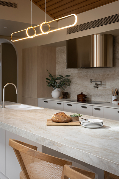 kitchen-close-up-shot-with-benchtop-and-appliances-and-statement-gold-pendant-light-The-Block-2025-House-3