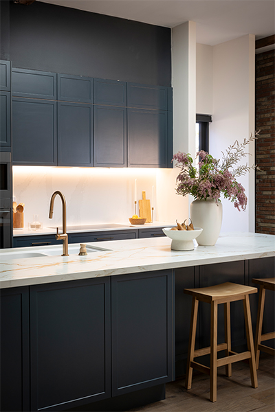 Dekton Reverie kitchen island bench with 40mm waterfall edge, serving as the kitchen’s bold focal point with seating area.